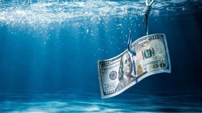 A moeda norte-americana era cotada a R$ 4,98 (Imagem: Shutterstock)